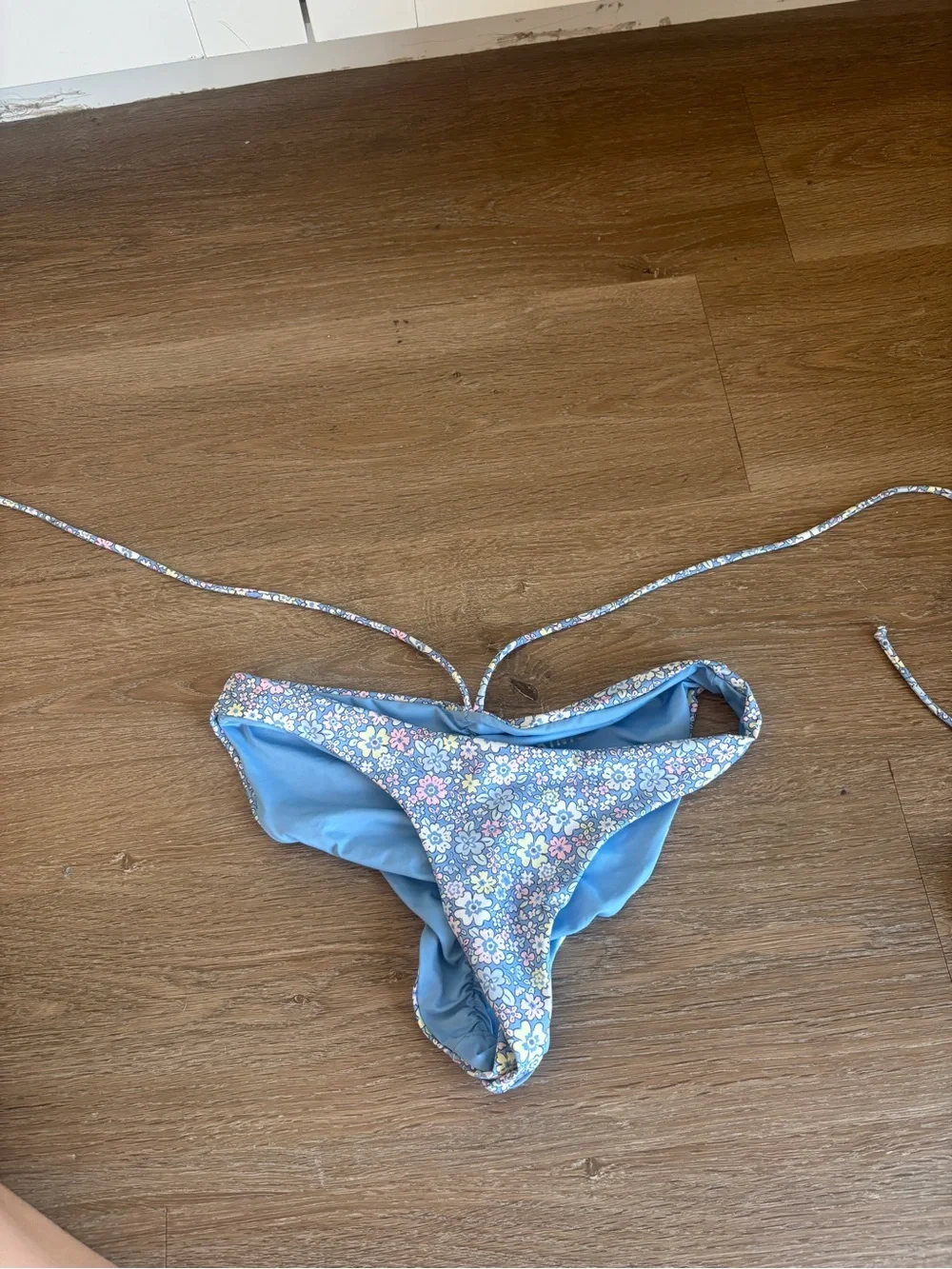 Frankie’s Bikinis blue floral bikini top and medium bottom
